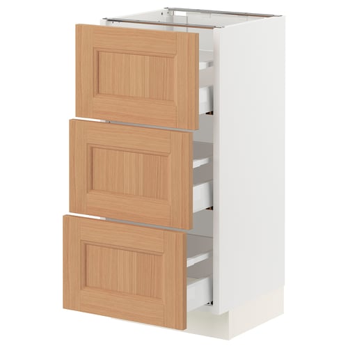 A modern white SEKTION kitchen cabinet with three light oak drawers, featuring a sleek design and sturdy build.