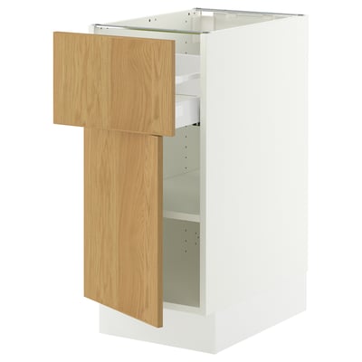 White SEKTION cabinet with adjustable shelves and light wood door.