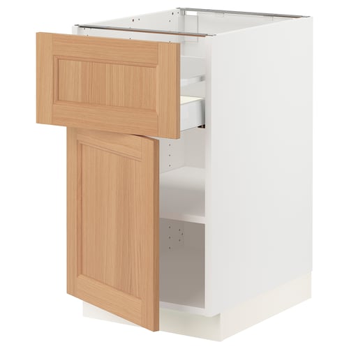 SEKTION kitchen cabinet in white, light wood, with open door revealing shelves. Modern, minimalist design.