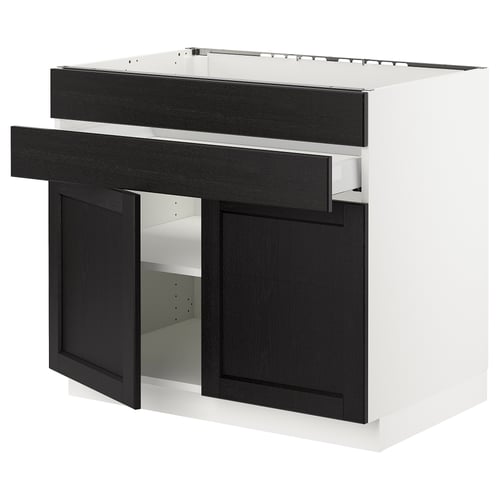 Modern kitchen unit: SEKTION. White base, dark wood drawers. Two doors, one open. Metal hinges visible.