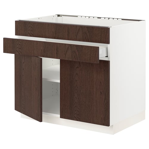 Ikea SEKTION kitchen unit in dark brown with adjustable shelves, sturdy white frame, and wooden drawer fronts. Modern, rectangular design.