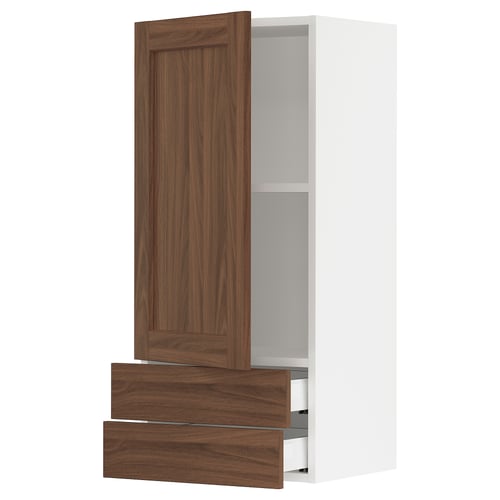 Walnut-colored SEKTION kitchen cabinet with two open drawers and a single door.