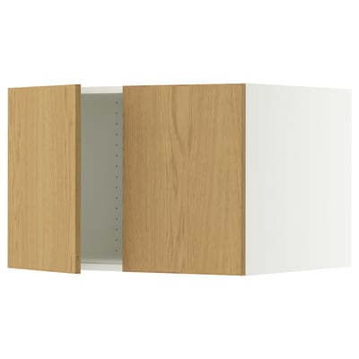 A SEKTION kitchen cabinet in oak veneer with a white frame. It has two adjustable shelves and damper hinges for silent closure.