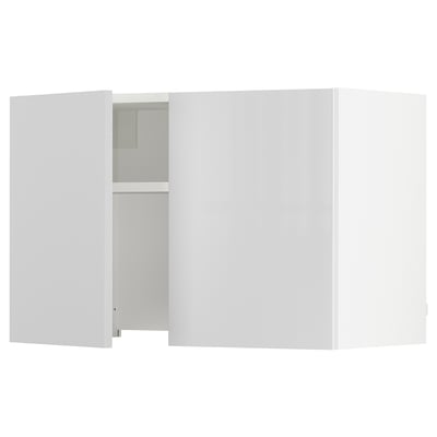 White kitchen cabinet with one door open; modern, glossy finish.
