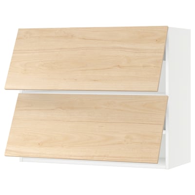 Two light wood cabinet doors on white frames, part of the SEKTION kitchen system.