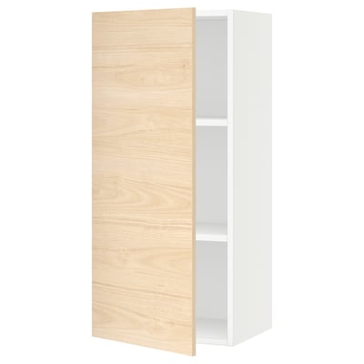 A white SEKTION kitchen wall cabinet with a light ash wood door, featuring adjustable shelves.