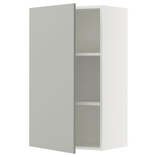 A grey SEKTION kitchen cabinet with one open door, revealing shelves inside.