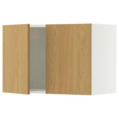 A SEKTION kitchen cabinet with wooden doors. One door is open revealing the inside. The cabinet is light-colored with solid oak trim.
