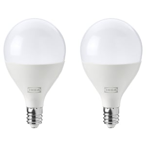 Two white, spherical ikea led light bulbs with e12 base, dimmable, energy-efficient.
