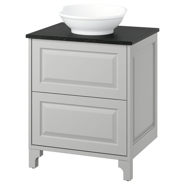 A white TÄNNFORSEN bathroom vanity with a black countertop and a ceramic sink. It has two drawers and a classic design.
