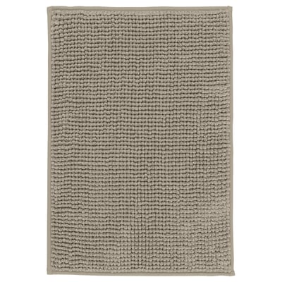 A TOFTBO bath mat in grey. It a soft, textured surface and is rectangular in shape.