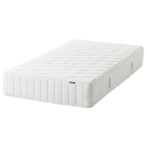 Depicts a white VÅGSTRANDA mattress with pocket springs, designed for comfort and support.