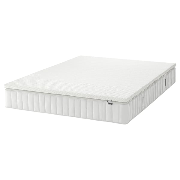 White IKEA valkevag memory foam & spring mattress, rectangular.
