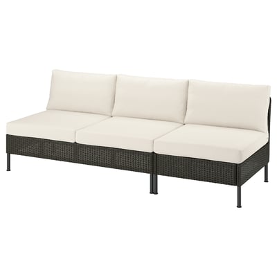 Modern wicker patio sofa, beige cushions, dark frame, modular design.