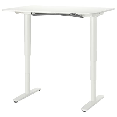 White BEKANT standing desk with adjustable height, modern design, cable management.