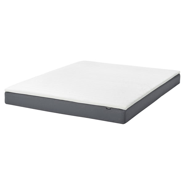 IKEA blåfjellet 5. 5 white foam mattress with grey base, rectangular, simple design.