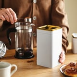 BLOMNING Tin with lid, off-white/for coffee/tea, 10x10x20 cm