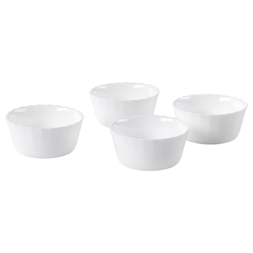 Four white round bowls, made of tempered opal glass, arranged on a white background.