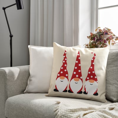 Girfjället cushion on couch, beige with gnome heads, recycled cotton, zip, festive.