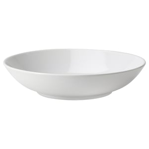 A single white ceramic bowl with smooth edges, simple and elegant for various occasions.