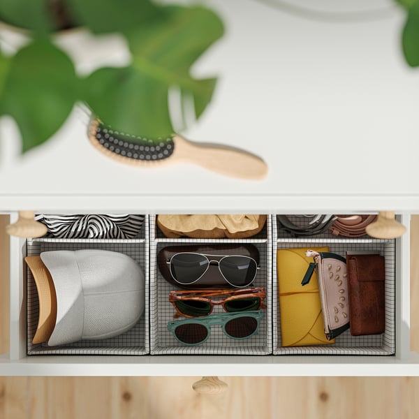 Organised storage bins with hats, sunglasses, and wallets. Includes safety anchoring kit.
