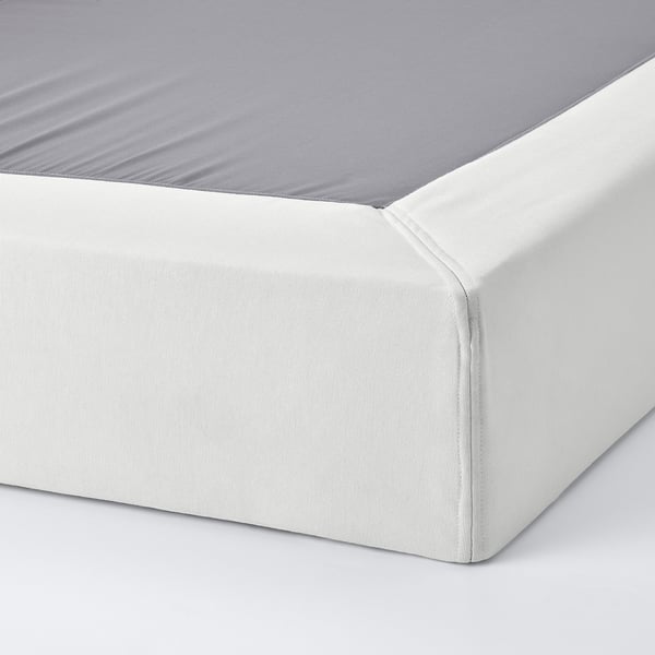 Clean, white mattress base with neat, smooth edges and grey sheet, showcasing quality design and cleanliness.