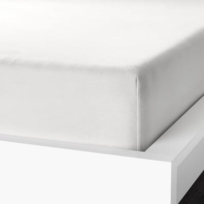 Close-up of soft, brushed flannel sheet set, showing thick cotton fabrics texture and fitted sheets elastic design.