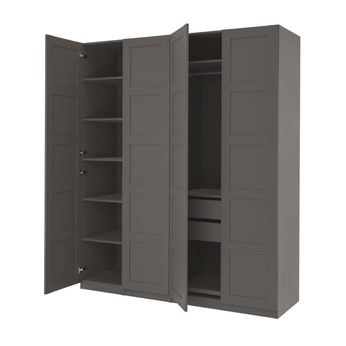 An open grey PAX wardrobe, showcasing multiple shelves and drawers for storage.