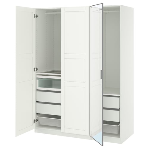 A white PAX wardrobe with mirror doors and drawers. It multiple compartments and storage solutions, including shelves and mesh baskets.