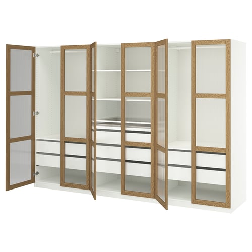 Displays an open white and oak PAX wardrobe with multiple shelves and compartments.