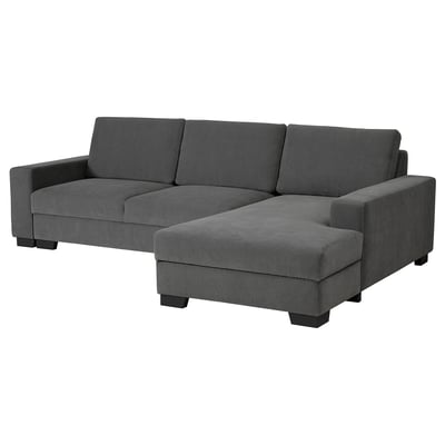 Grey modern l-shaped sofa with dark wood legs, minimalist style, offers seating and storage.