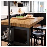 VADHOLMA Kitchen island with rack, black/oak, 126x79x193 cm