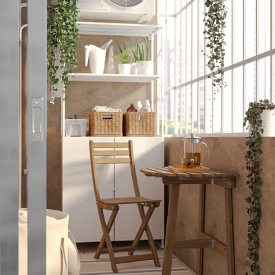 ASKHOLMEN Table mur+1 chaise pliante, ext, brun foncé, 70x44 cm