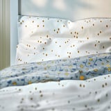GULDVÄVARE Funda plumón y funda almohada cuna, azul/blanco floral, 110x125/35x55 cm