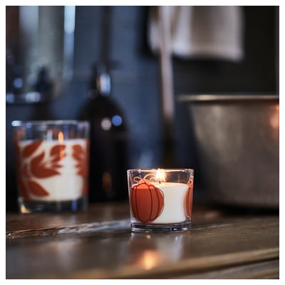 HÖSTAGILLE Vela aromática en vaso de vidrio, calabaza vidrio incoloro/naranja, 20 hr