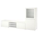 Bílý televizní stolek BESTÅ se sklem a uzavřenými skříňkami, moderní a všestranný pro média a dekorace.