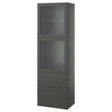 Šedá skříňka ikea BESTÅ se skleněnými dvířky a zásuvkami. Je vysoký, obdélníkový a má moderní linie.