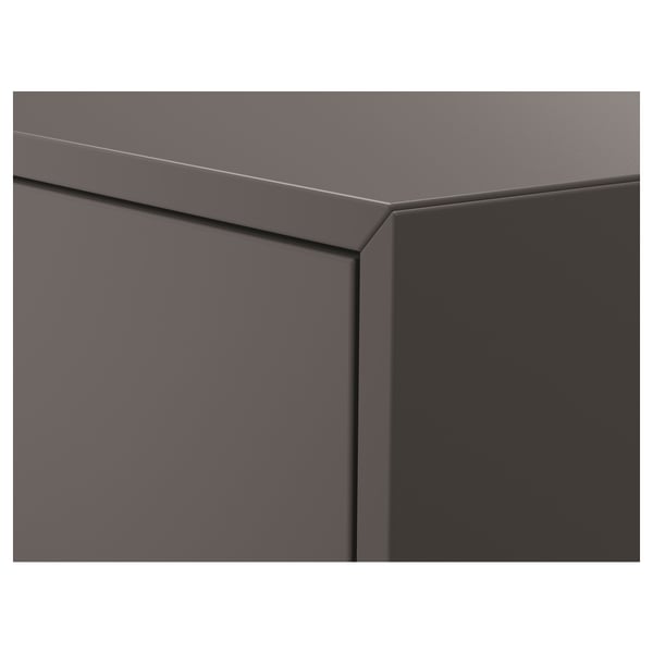 Detail skříně EKETe: elegantní, moderní design; hladký, tmavě šedý povrch; robustní konstrukce.