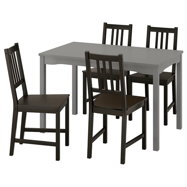 Šedý jídelní set HAUGA s obdélníkovým stolem a 4 černými židlemi, minimalistický design, ideální do malých prostor.