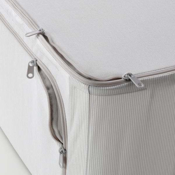 Detail odolného rohu látkového úložného boxu na zip, který ukazuje robustní konstrukci a vysoce kvalitní materiály.