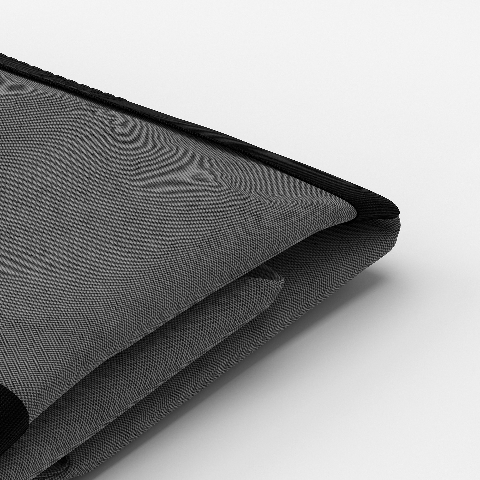 Detailní záběr na černý okraj skříně akurum, který ukazuje její elegantní, texturovaný povrch a kvalitní řemeslné zpracování.