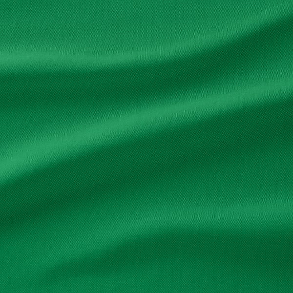 Detail ze zelené látky, hladká vazba, jemný dvoubarevný efekt, vysoce kvalitní textura.