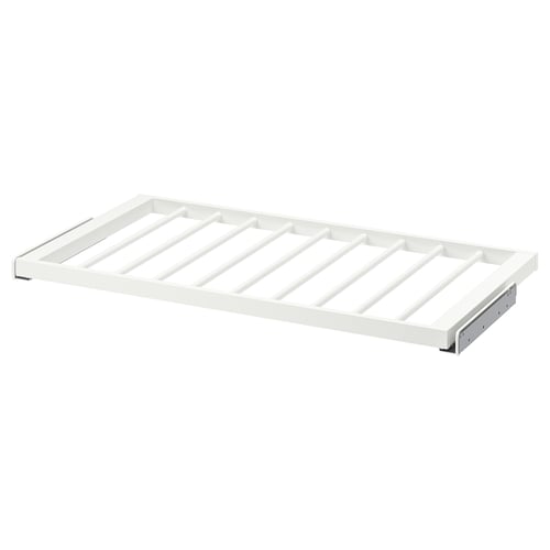 Bílé ramínko na kalhoty KOMPLEMENT s mřížkovým designem pro přehledné ukládání.