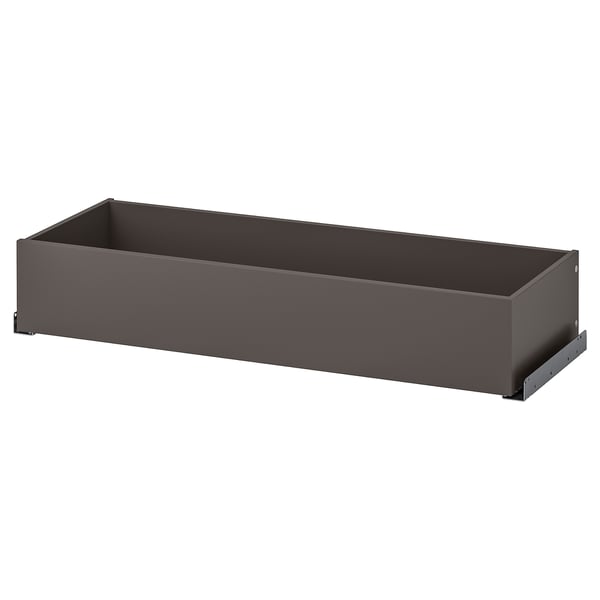 Zásuvka KOMPLEMENT, šedá, obdélníková, minimalistický design, vyrobená z dřevotřísky a papírové fólie.