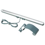 LED lampa LAGERGÅNG v zelené barvě. Připevňuje se k obrazovkám, má nastavitelné světlo a kabel USB-C.