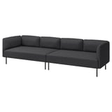 Moderní šedá pohovka ve tvaru písmene L s tmavými kovovými nohami, jednoduchý design.