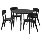 Černá kruhová jídelní souprava se čtyřmi sladěnými židlemi, moderní design.