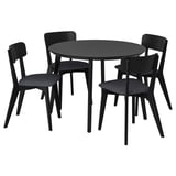 Černý kulatý jídelní stůl se čtyřmi odpovídajícími židlemi, elegantní design, materiály z tvrdého dřeva.