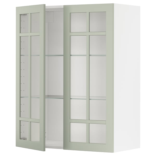 Kuchyňská skříňka Ikea METOD se zelenými skleněnými dvířky a nastavitelnými policemi.