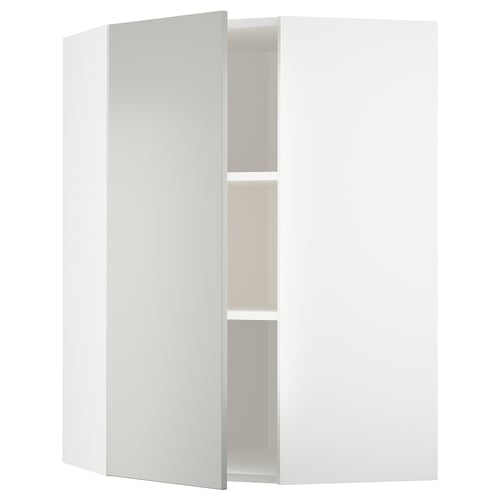 Bílá rohová skříňka, součást kuchyňského systému ikeas METOD, se světle šedými čely havstorp s elegantním, moderním designem.
